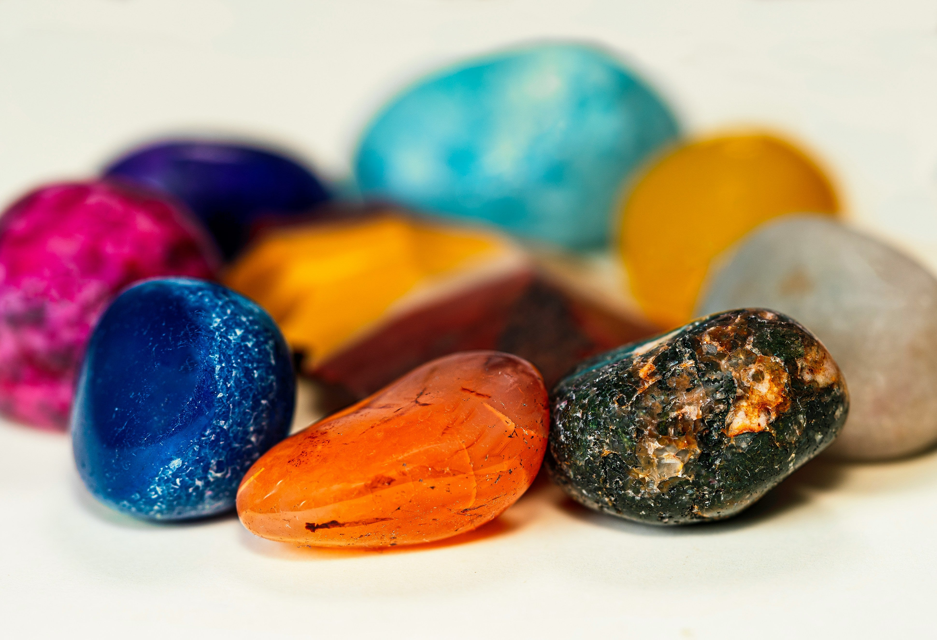 A close up of lots of multi-colored gemstones
