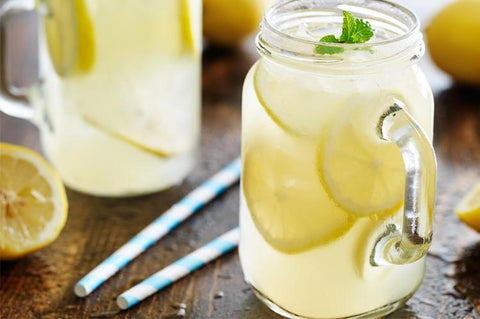 This glass of honey sweetened mint lemonade with sliced lemon is very low in sugar and packed with Vitamin C