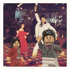 Curio & Co. watches Saturday Night Fever with Jasper Fforde. Background image of John Travolta & Karen Lynn Gorney dancing in Saturday Nigh Fever with Lego posing the some way in foreground. Curio and Co. www.curioandco.com