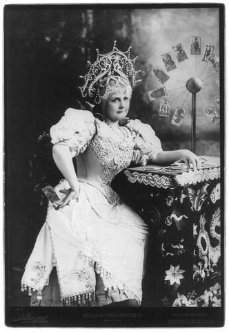 Pennyland Madam Prognostica Seated three-quarter view facing Tarot of Musterberg cards (fortune teller)