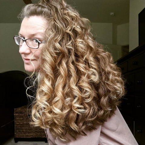 Woman with big, curly blond hair 