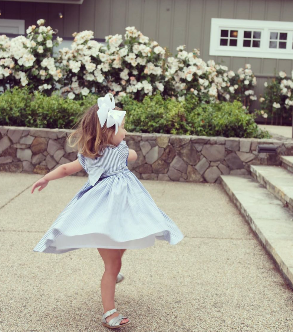 Blue and white striped twirling smocked dress Charlotte sy Dimby