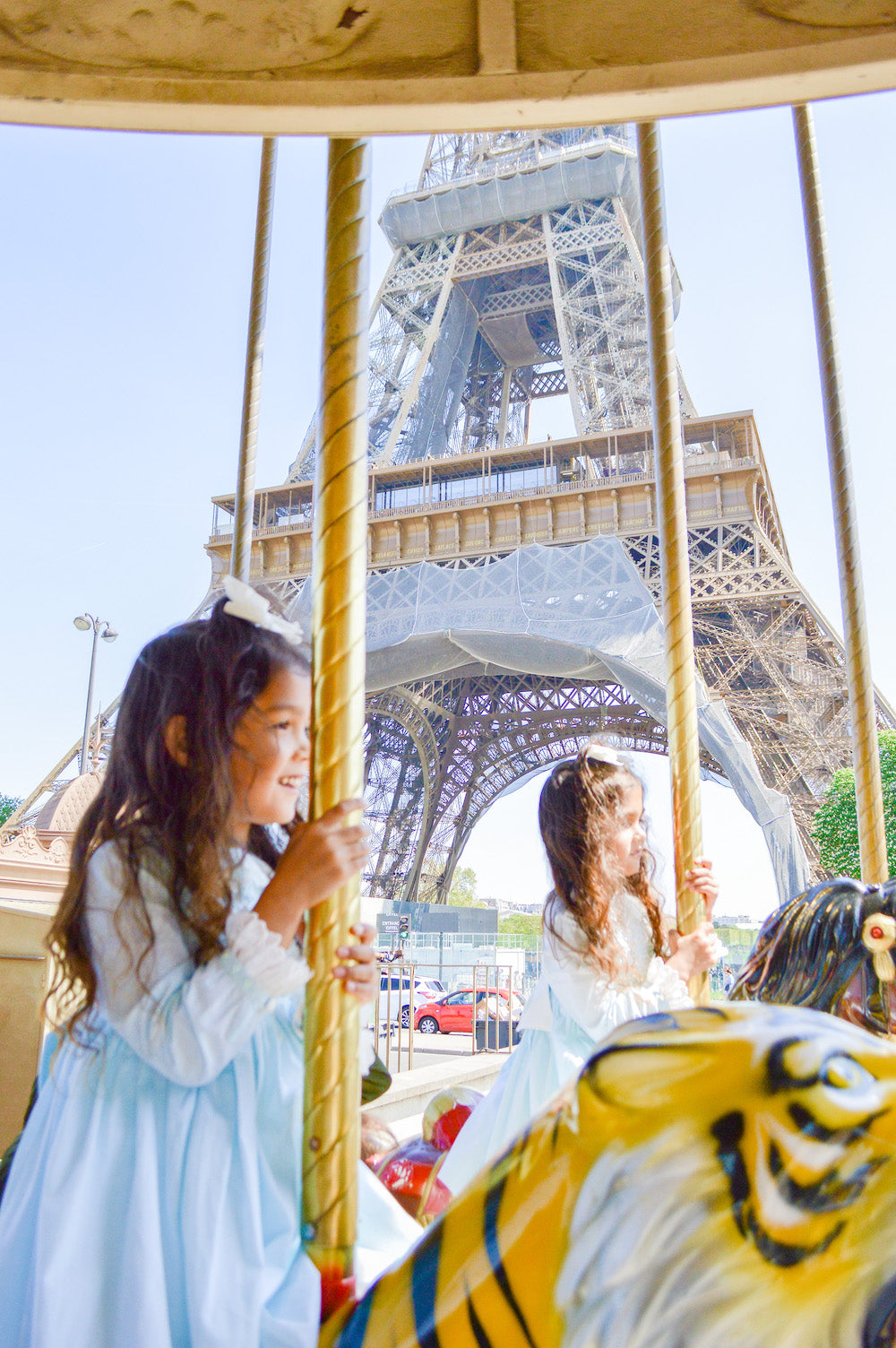 Travelling to Paris with Kids - Best kid friendly family places to visit in Paris - children's boutiqueCharlotte sy Dimby L'Île aux Fées carousel Eiffel Tower