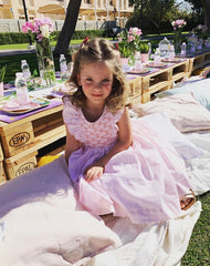 Lola in her summer handmade pink Netti smocked dress