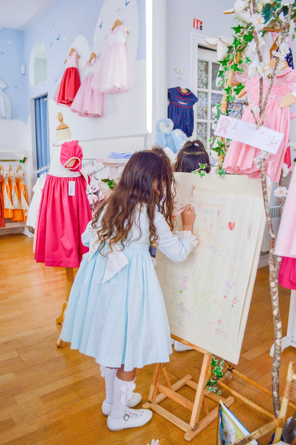 Travelling to Paris with Kids - Best kid friendly family places to visit in Paris - children's boutique Charlotte sy Dimby L'Île aux Fées French style dresses 