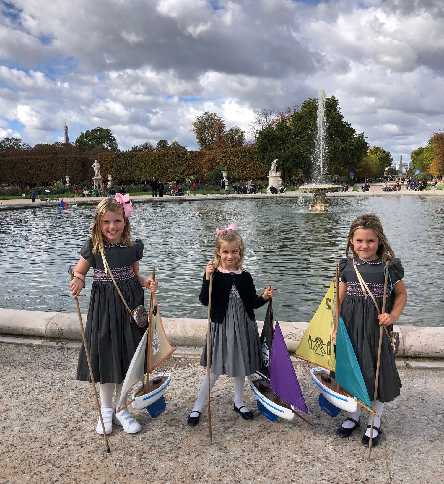 Paris with kids travelling to Paris as a family advice children's store clothing boutique handmade traditional dresses for little girls Jardin du Luxembourg