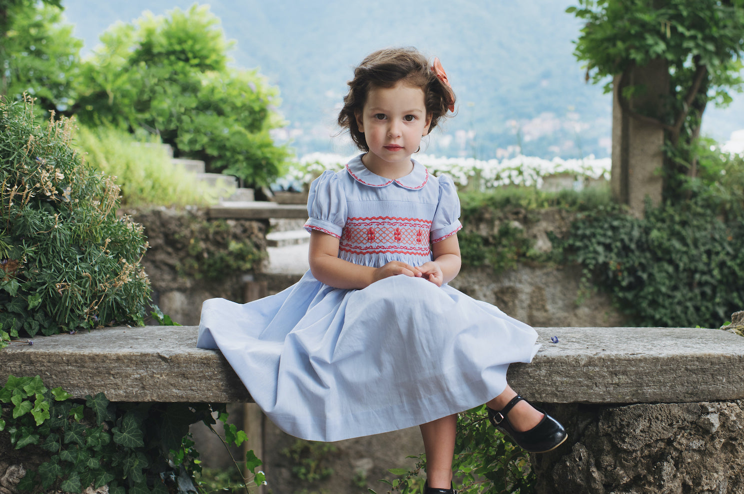 Princess Charlotte of Cambridge of Wales Royal British timeless chic lavender blue smocked dress classic european style clothing for children baby and girl