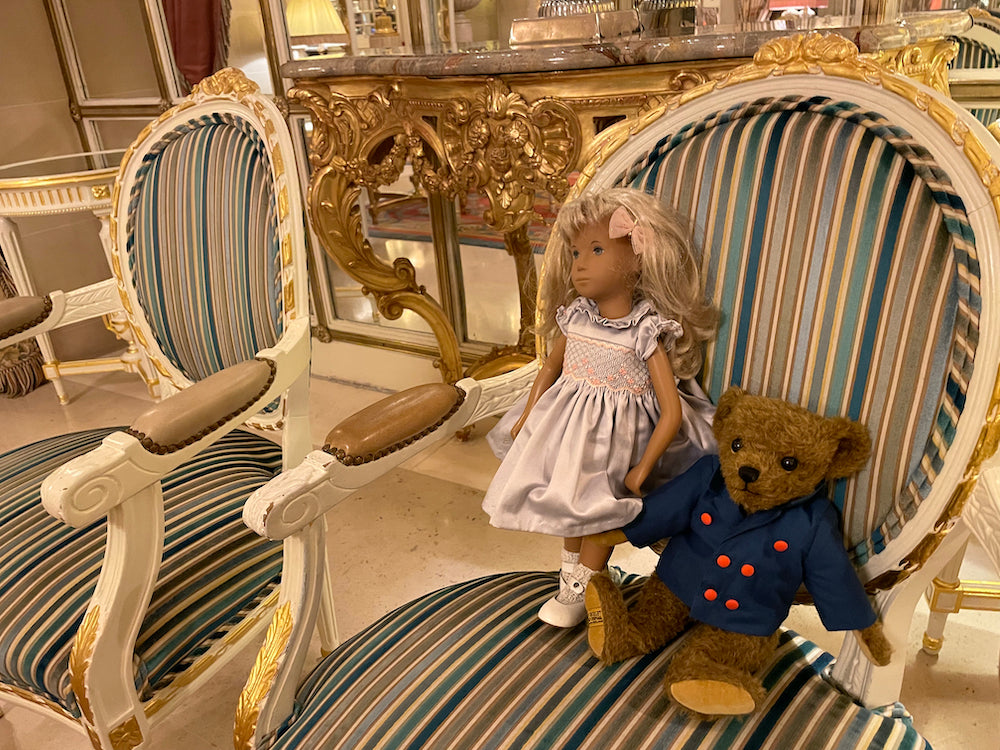 Doll and bear at the Ritz London