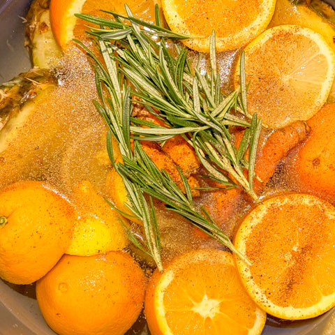 water with orange, lemons and pineapple