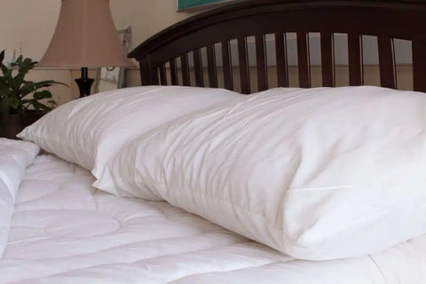 Cotton pillows on a bed.