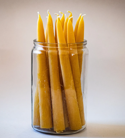Beeswax candles in a jar.