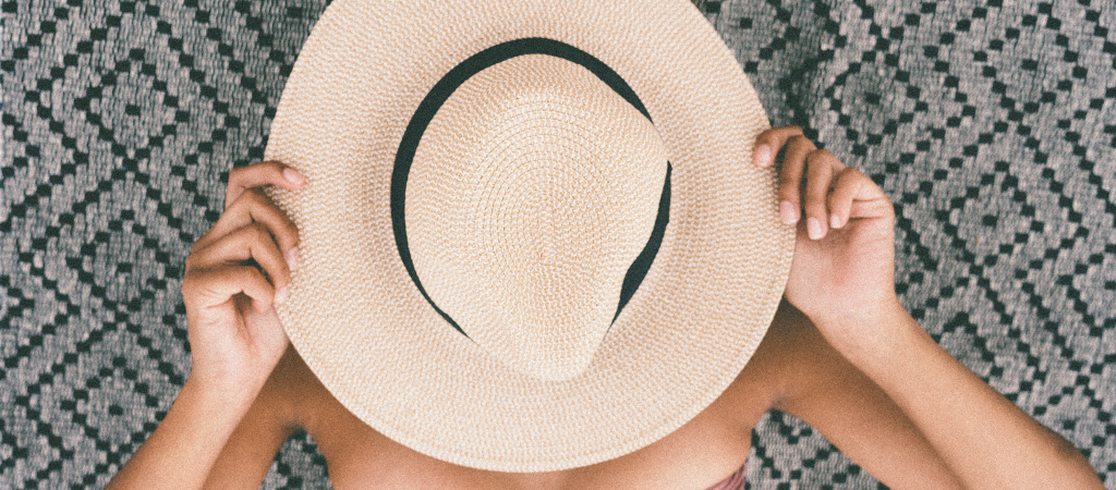woman with hat on face