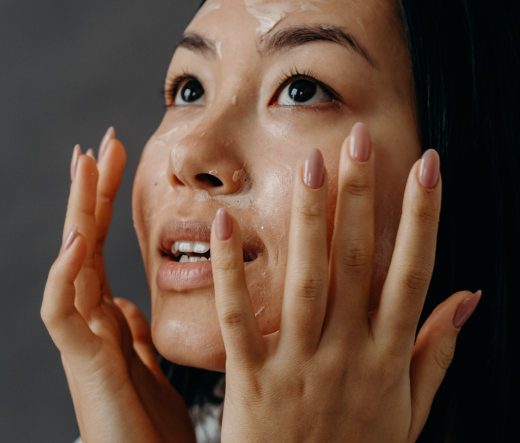 woman touching face with both hands