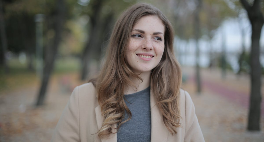 woman in park smiling