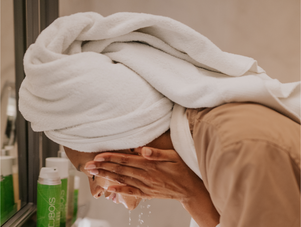 woman washing her face