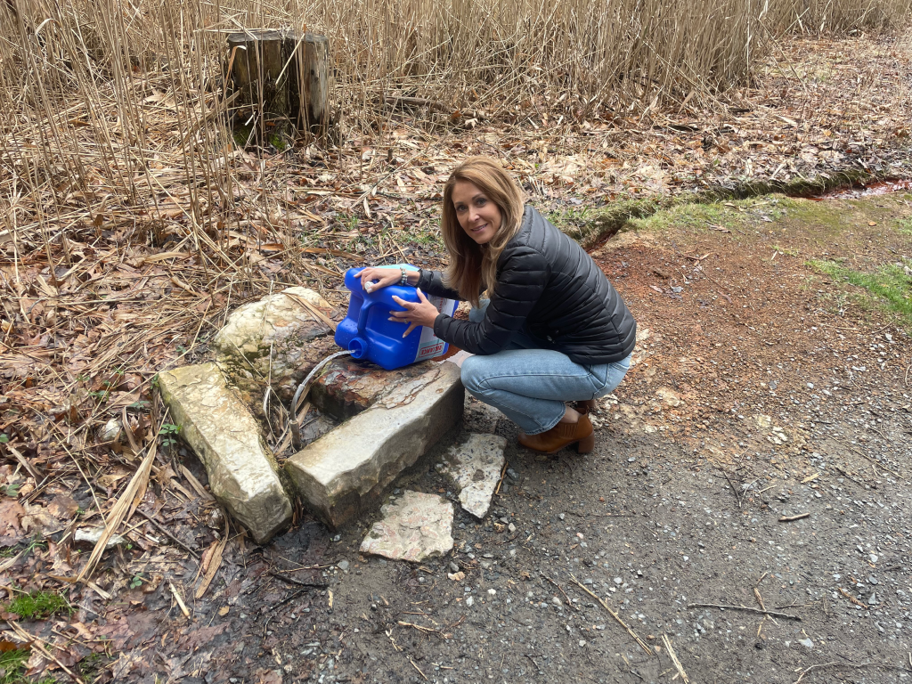 Denise collecting Saratoga Springs mineral water for the Dubois Beauty mists