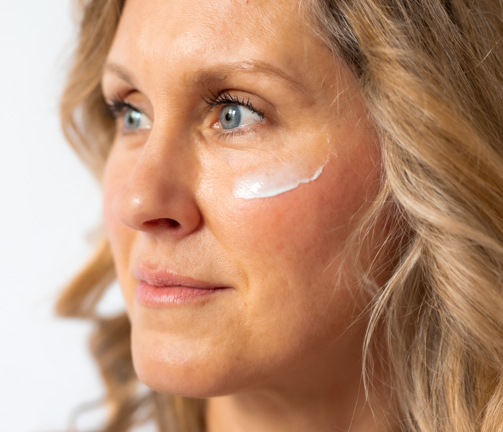 woman with moisturizer on her face