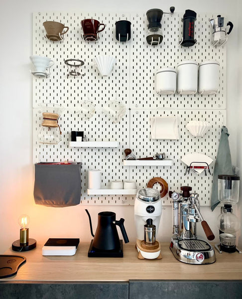 Home coffee bar with pegboard for hanging gear