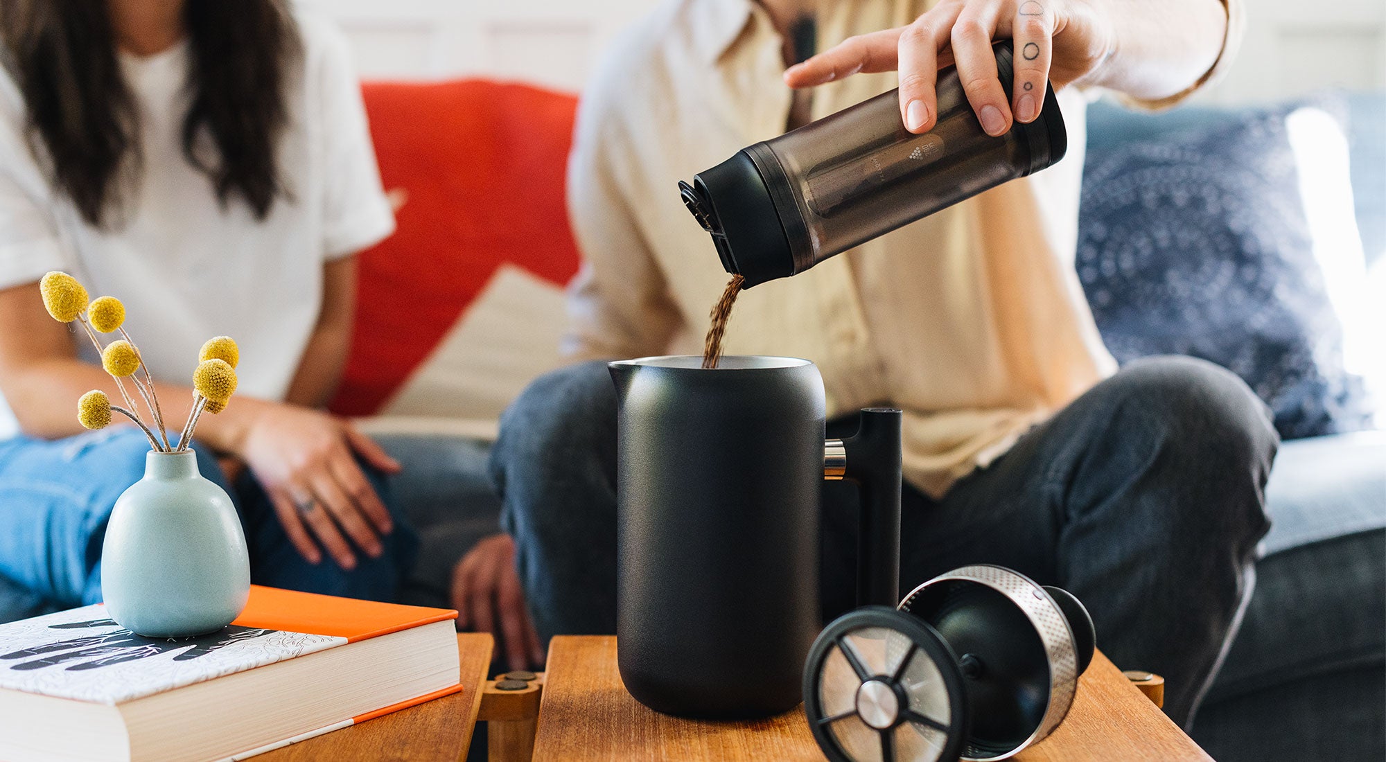 Shimmy Coffee Sieve pouring grinds into Clara French Press