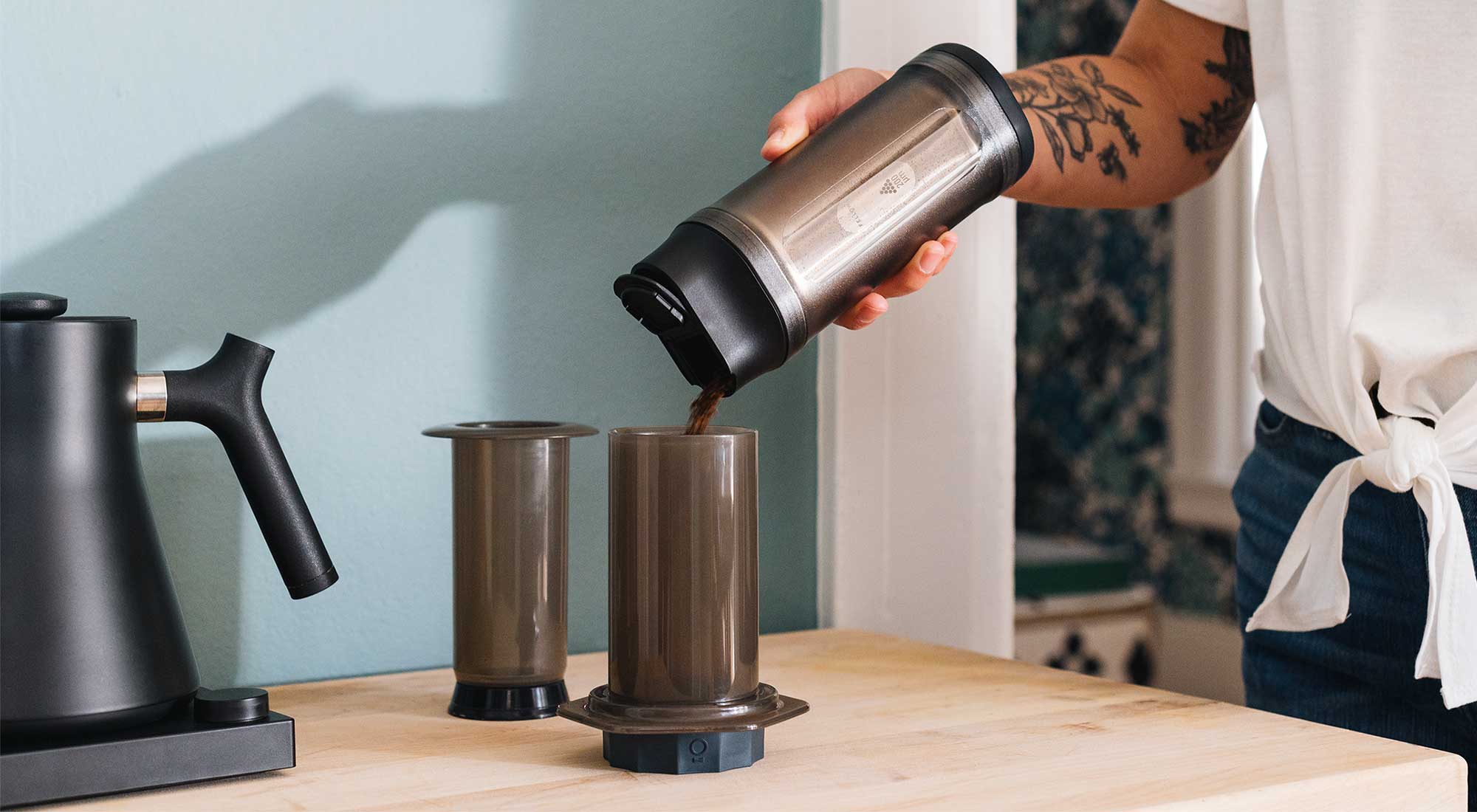 Shimmy Coffee Sieve pouring grinds into Prismo AeroPress Attachment