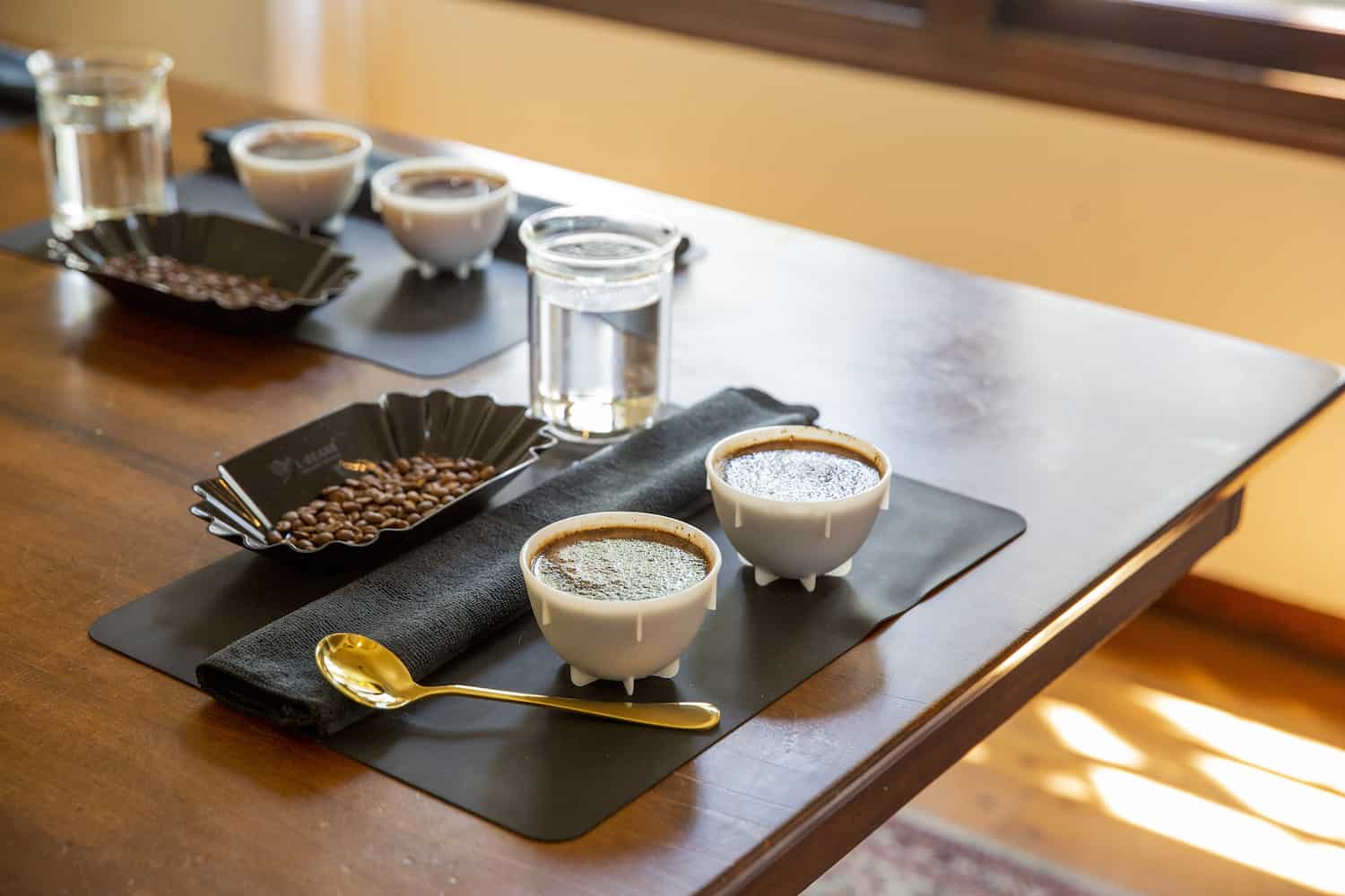 Coffee Beans Inside Shot Glass On Weight Scale With Empty Coffee