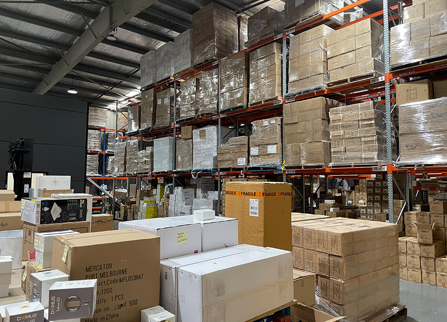 Inside of The Lighting Outlet's Warehouse showing many boxes stacked on pallet racks