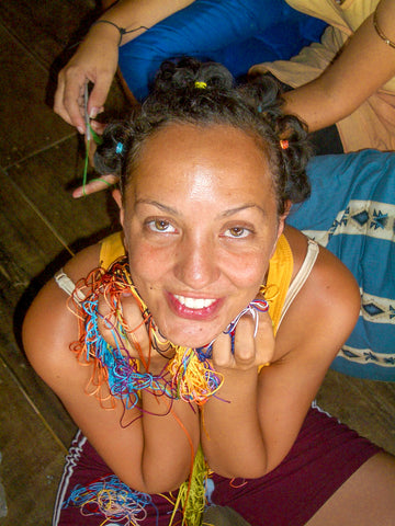 Saskia with jewelry-making thread from Cambodia