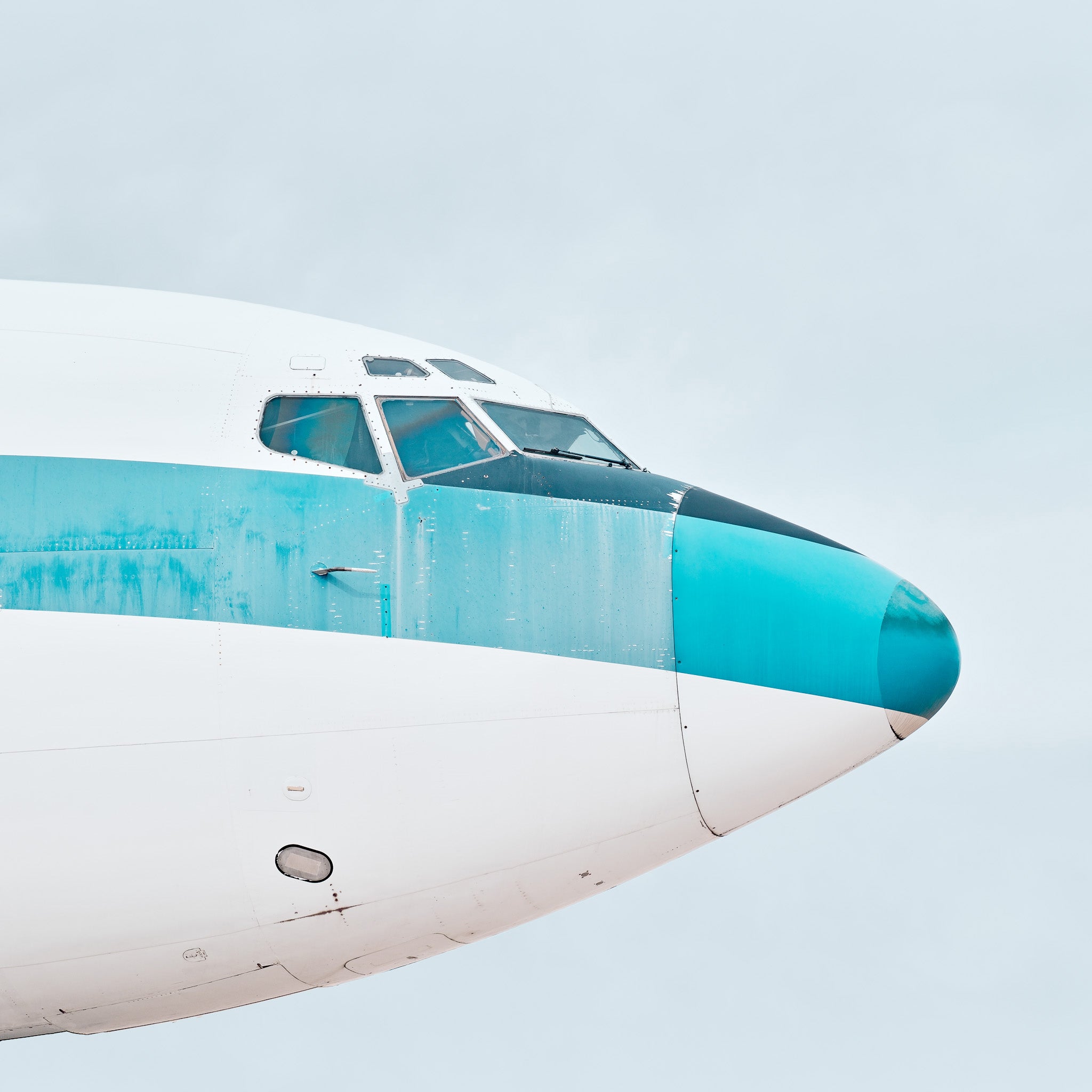 photograph of the faded nose of an airliner from the past. 