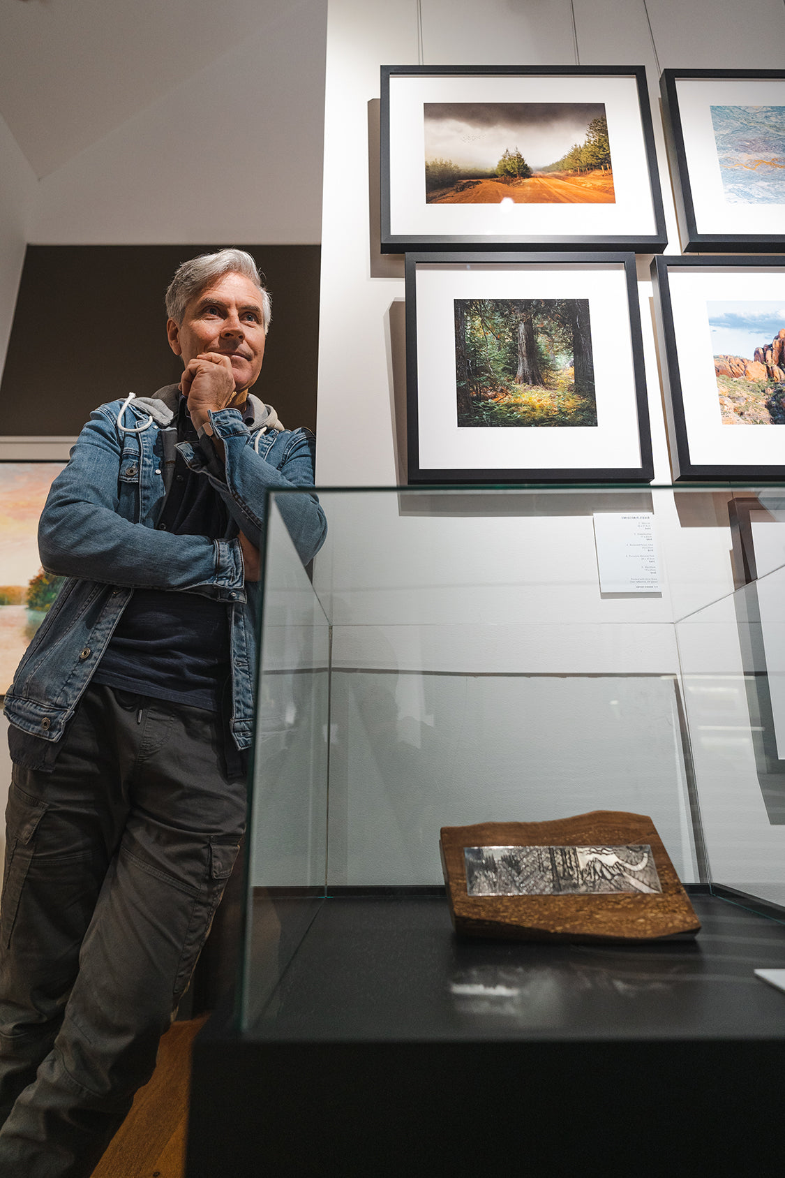 Christian Fletcher with his photography and John Miller designed stirling silver interpretation  (Photo credit to Jack Constantine)