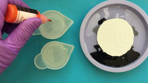prepare two mixing cups with resin