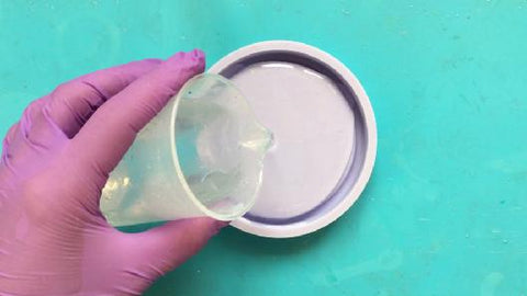 pour clear resin into coaster silicone mold