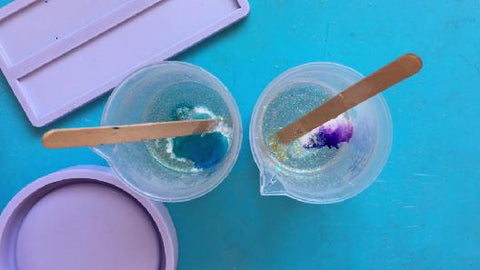 add glitter and ink into cups