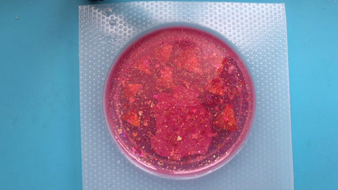 pour a layer of red colored epoxy resin into your mold