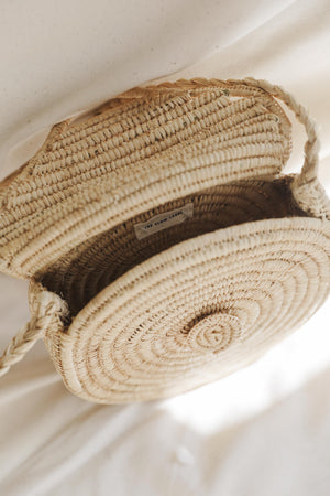 round raffia crossbody bag