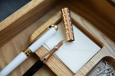 S.T. Dupont Line D In White & Gold and S.T. Dupont Liberte Black & Rose Gold