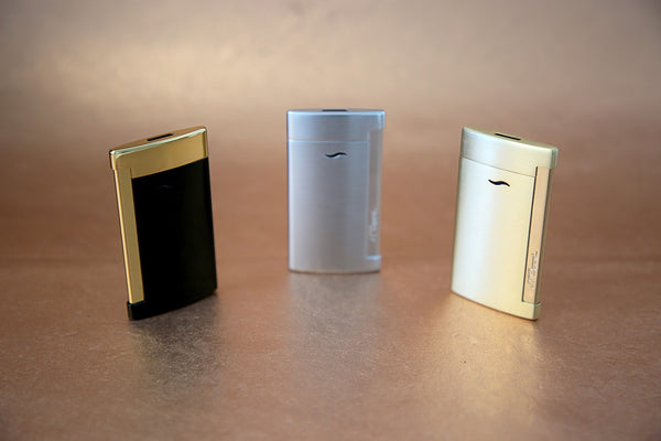 s.t. dupont slim 7 lighter in black & gold, chrome, and brushed gold