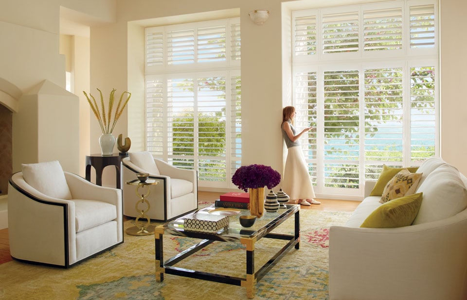 Sitting room with Hunter Douglas Palm Beach™ Shutters. Find these shutters at JC Licht in Chicago