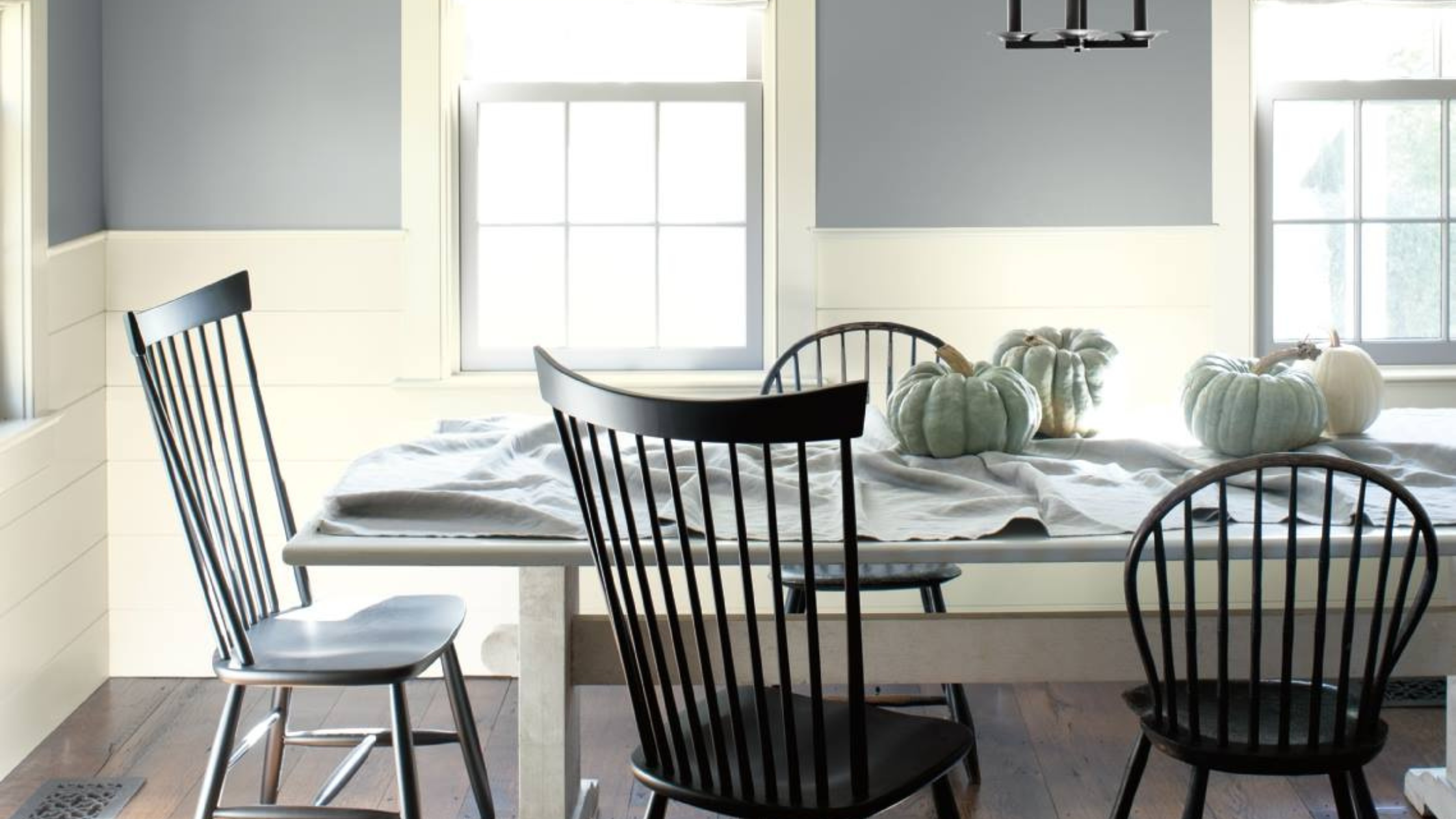 Make your home fall ready by incorporating pumpkins and other gourds. Enjoy fall inspired paint colors like this periwinkle gray in this dining room. Shop for paint at JC Licht in Chicago, IL. 