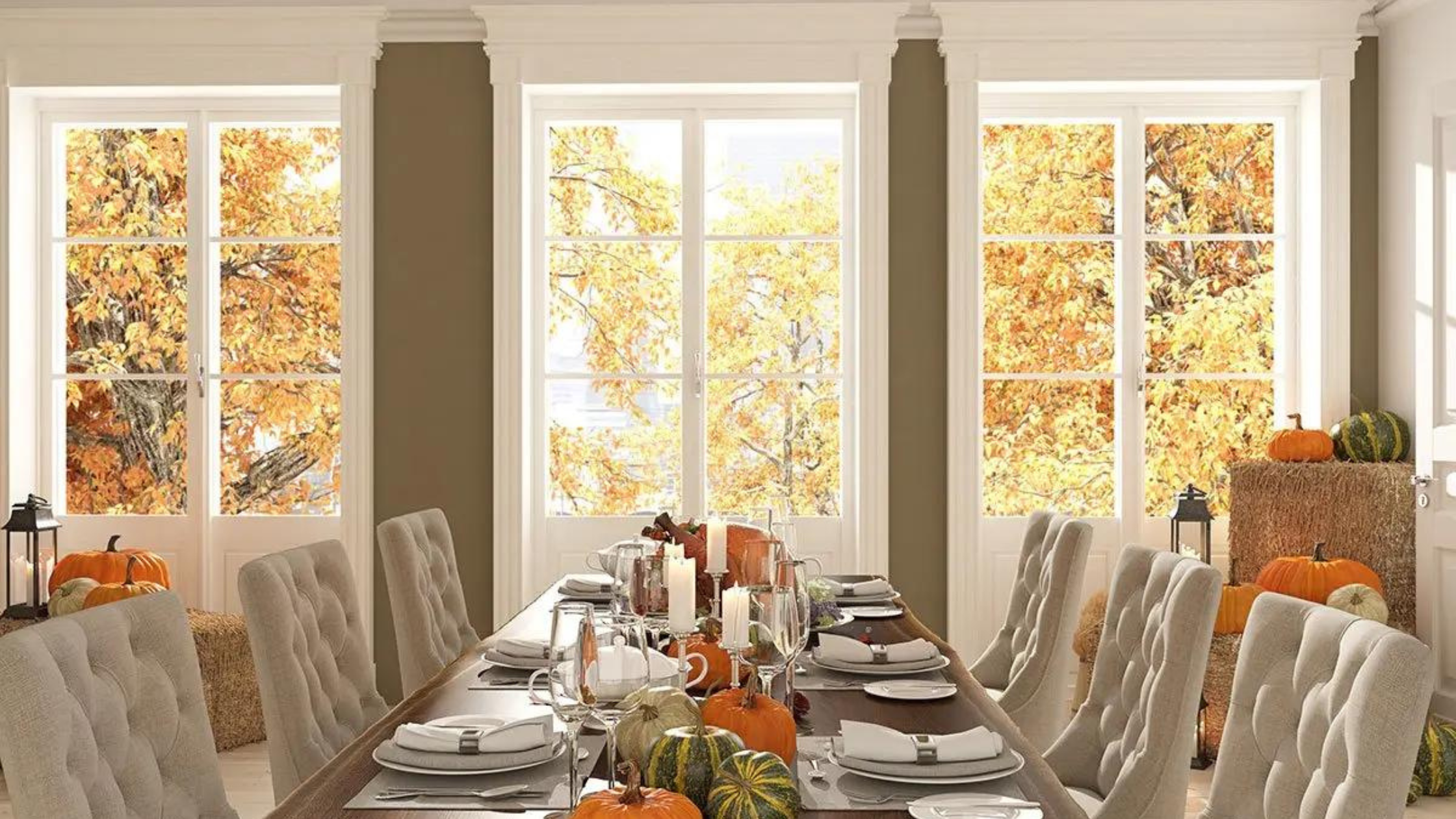 Thanksgiving table decorated with straw bales and pumpkins. Walls are painted in a lovely fall beige. Shop for interior wall paint at JC Licht in Chicago, IL