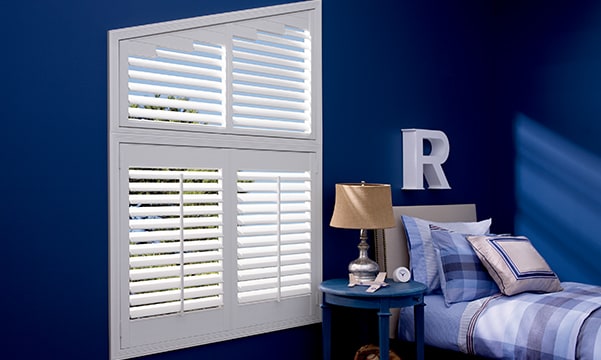 Angled window with custom shutters from JC Licht in Chicago, IL