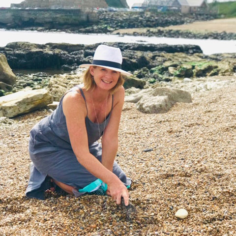 Kriket Broadhurst jewellery designer collecting seaglass in Seaham