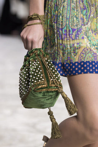 A Cinch drawstring bag being carried down a Runway