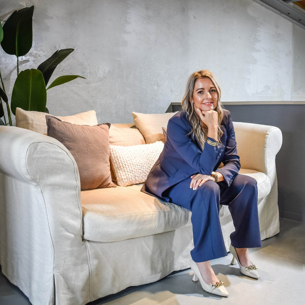 Luci Firth, Managing Director, sitting on a sofa in the Adashiko Office, Napier, Hawke's Bay, New Zealand | Adashiko Collagen | 100% Natural Skincare