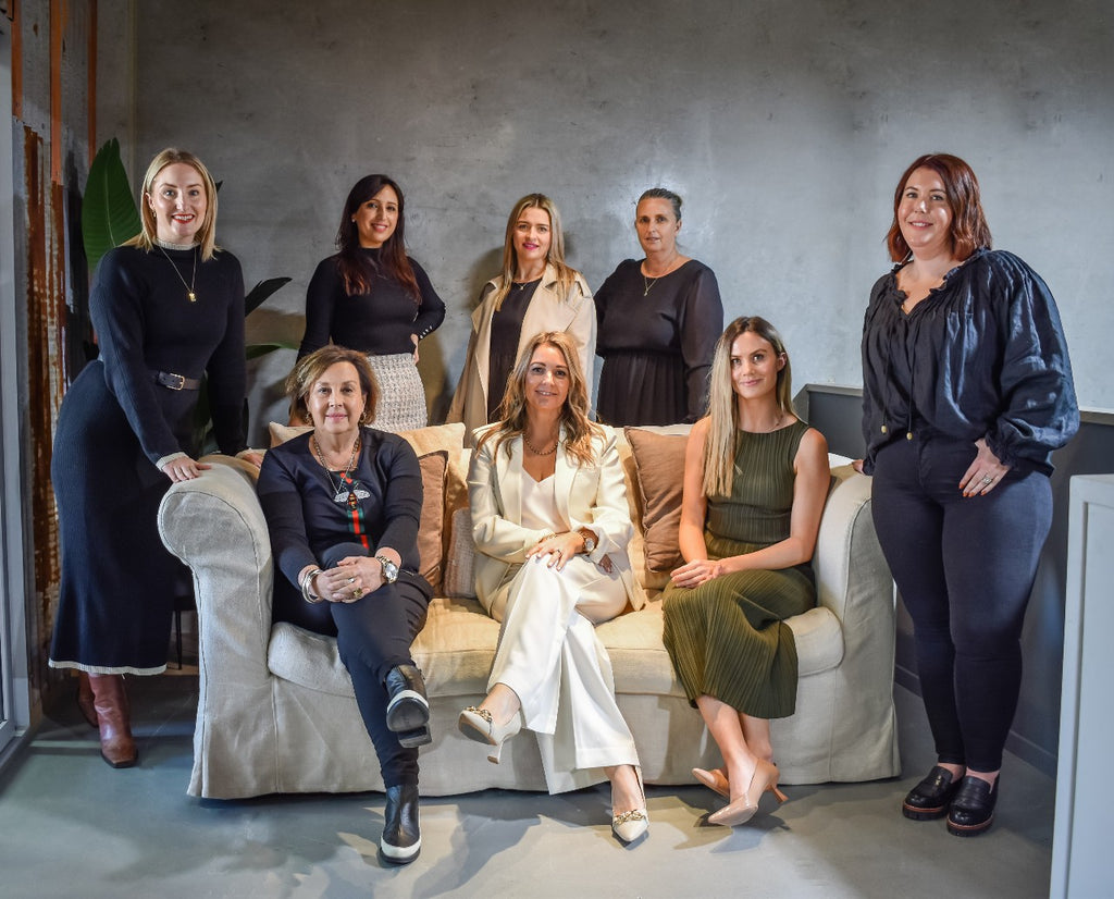 Team photo September 2023 - office mezzanine around the sofa | Adashiko Collagen | 100% Natural Skincare