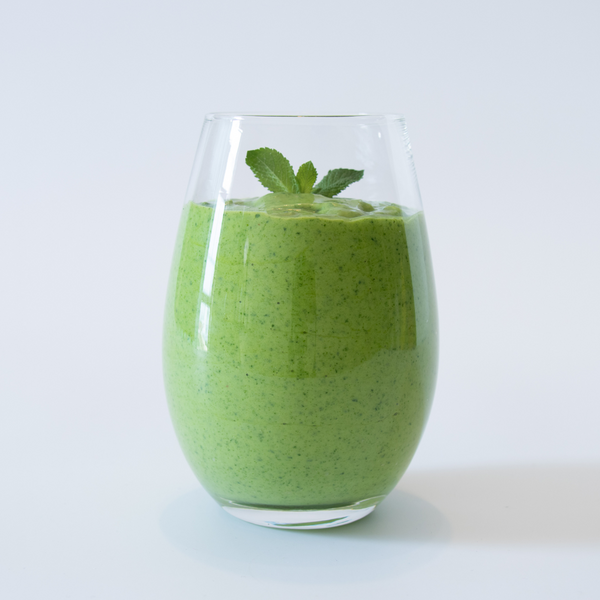 Antioxidant Supercharged Green Smoothie in a clear glass | Adashiko Collagen | 100% Natural Skincare