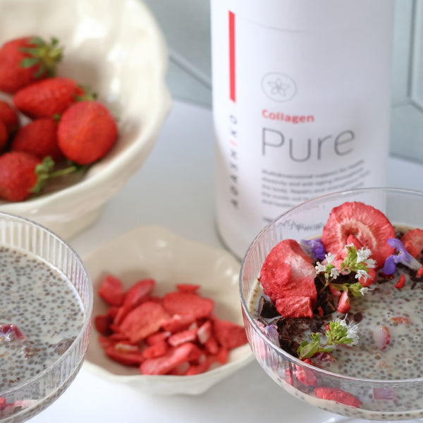 A glass bowl of Strawberry + Chia Seed Collagen Pudding next to a tub of Pure Collagen powder | Adashiko Collagen | 100% Natural Skincare