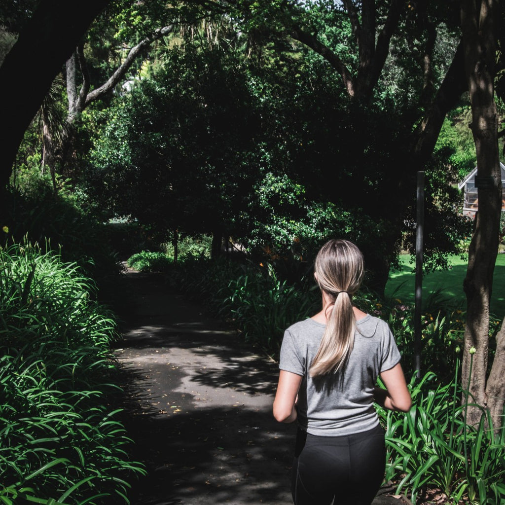Model jogging through park | Adashiko Collagen | 100% Natural Skincare