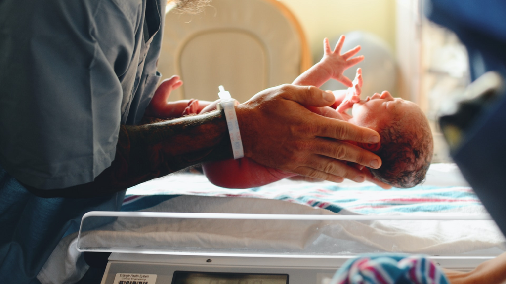 weighing a newborn baby