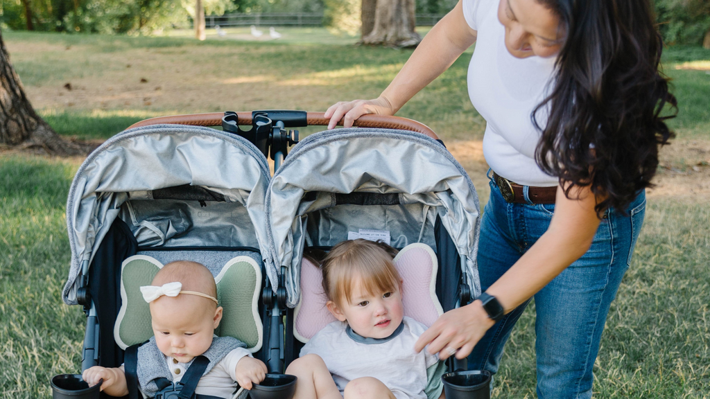 mother with her two children in strollers