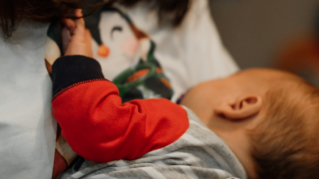 mother breastfeeding a baby